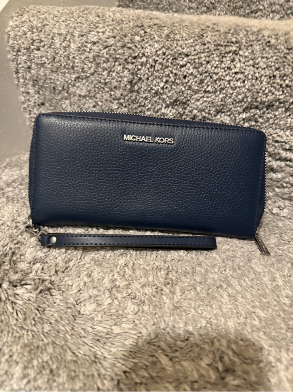 Michael Kors Large Pebbled Leather Continental Wallet in navy blue.
